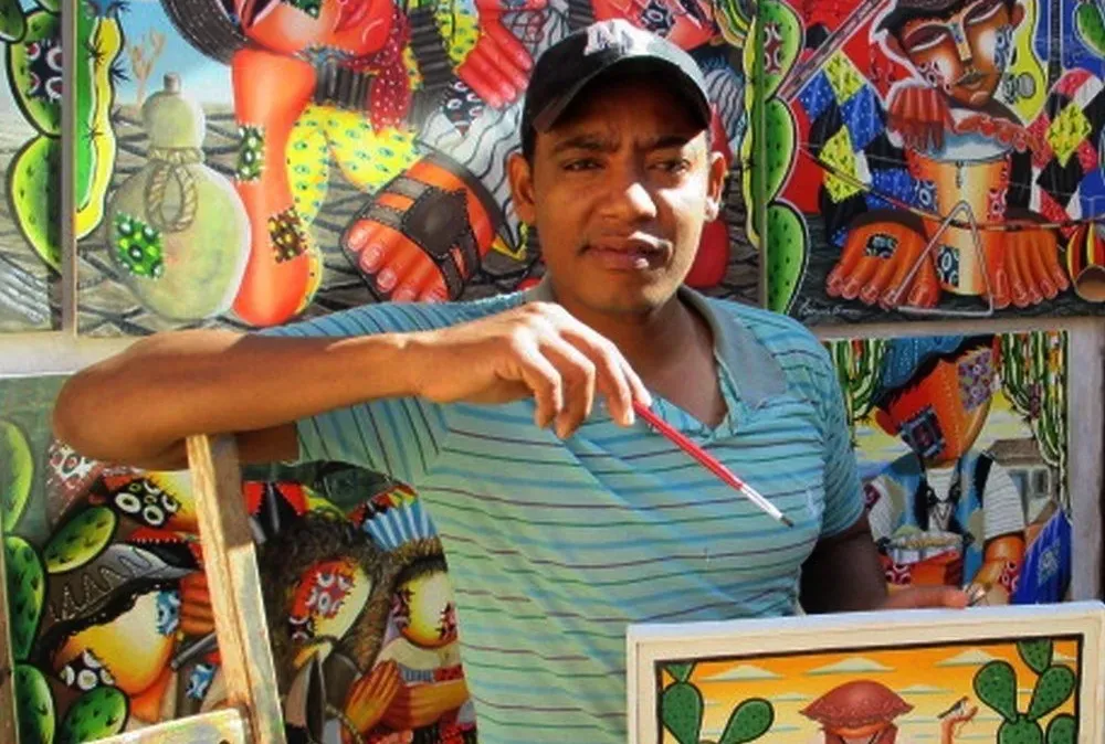 Ex-frentista, pintor baiano se emociona ao ver suas obras expostas no Louvre